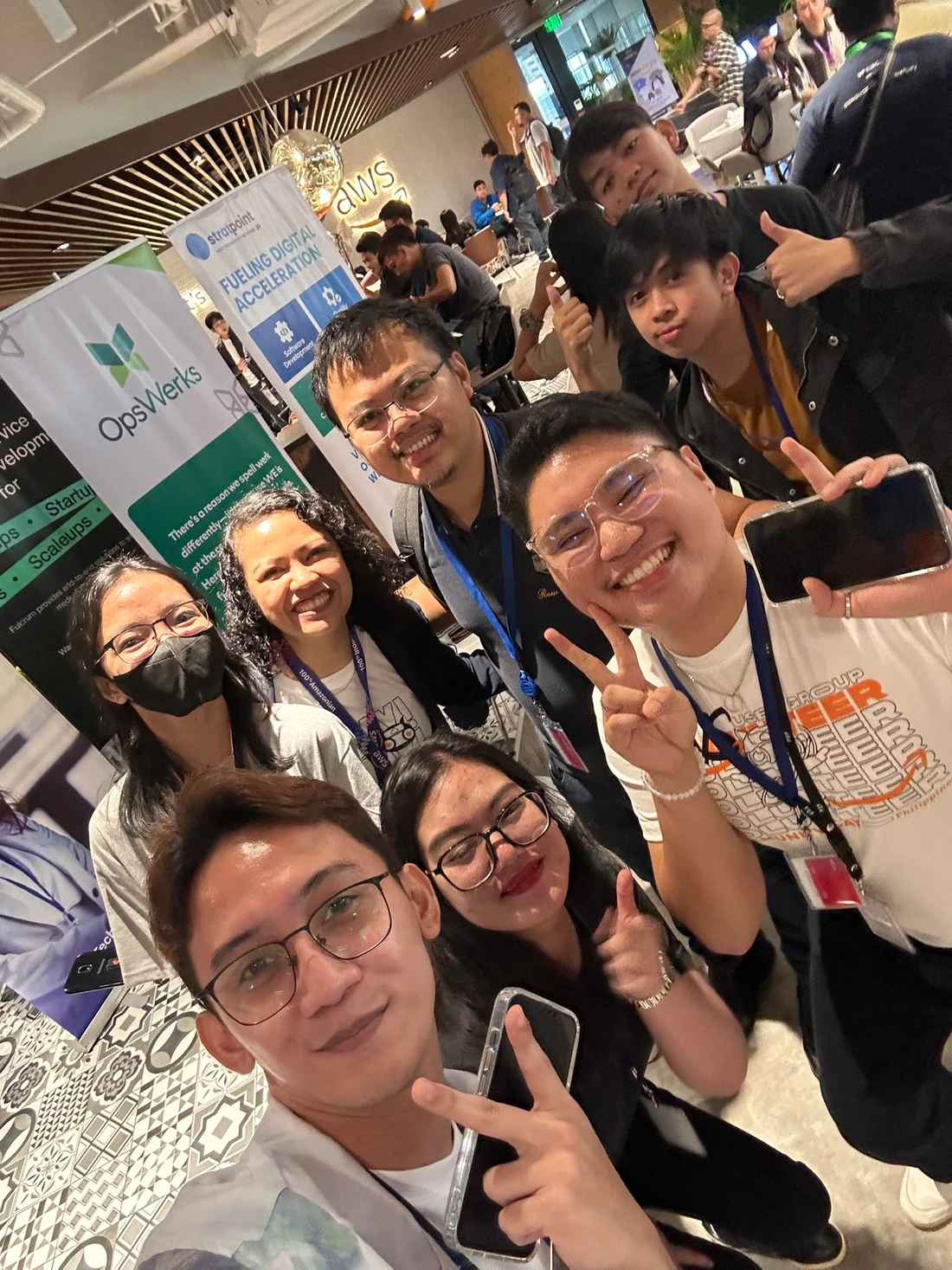 Alex and friends taking a selfie at a community gathering